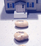 wishing_stones_in_front_of_a_model_house