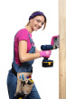 woman-construction-carpenter-installing-electrical-box-power-drill-on-white